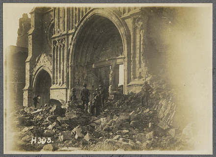 The ruins of Ypres Cathedral. N.Z. troops looking for souveniers.